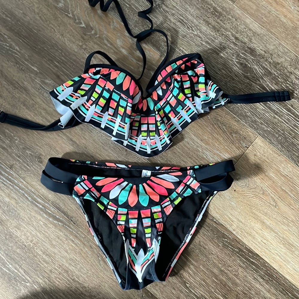 Rue bleu bathing suit. There is a little discoloration on top shown last picture